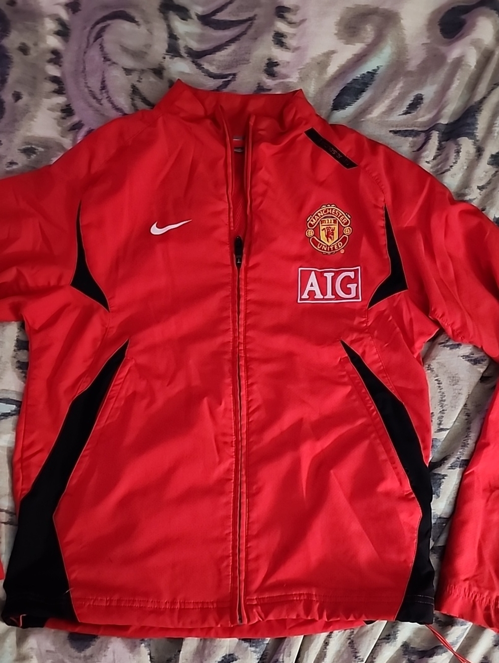 Nike Manchester United Red Track Jacket with AIG Crest